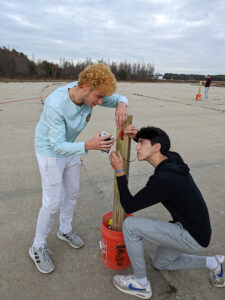 Competition for World Space Week. Student working on rocket.